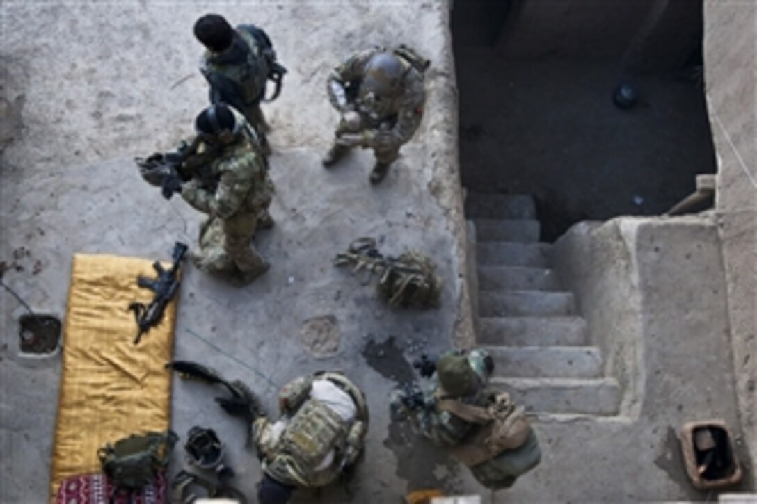 U.S. Special Forces soldiers prepare to patrol with Afghan army special forces during an operation in the Ghorband district in Afghanistan's Parwan province, Jan. 15, 2014. Afghan and U.S. forces conducted the operation with the goal of capturing several targets known for Taliban activity. The U.S. soldiers are assigned to the Combined Joint Special Operations Task Force Afghanistan.