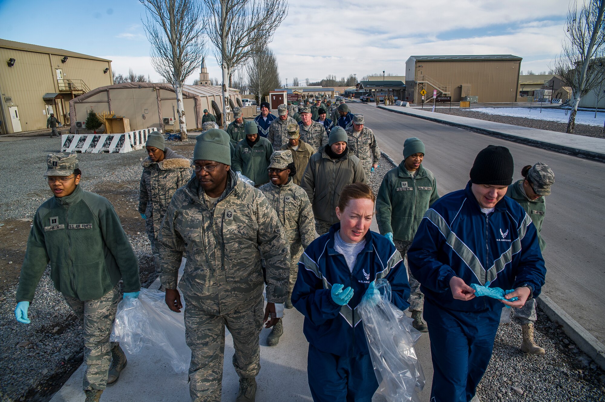 Participants of the Martin Luther King Day of Service walk to Frunze Forest at Transit Center at Manas, Kyrgyzstan, Jan. 15, 2014. More than 30 members of the transit center banded together to clean up a running trail located within the confines of the base. The cleanup was their way of giving back as part of "A Day of Service" to honor King. (U.S. Air Force photo/Senior Airman George Goslin)
