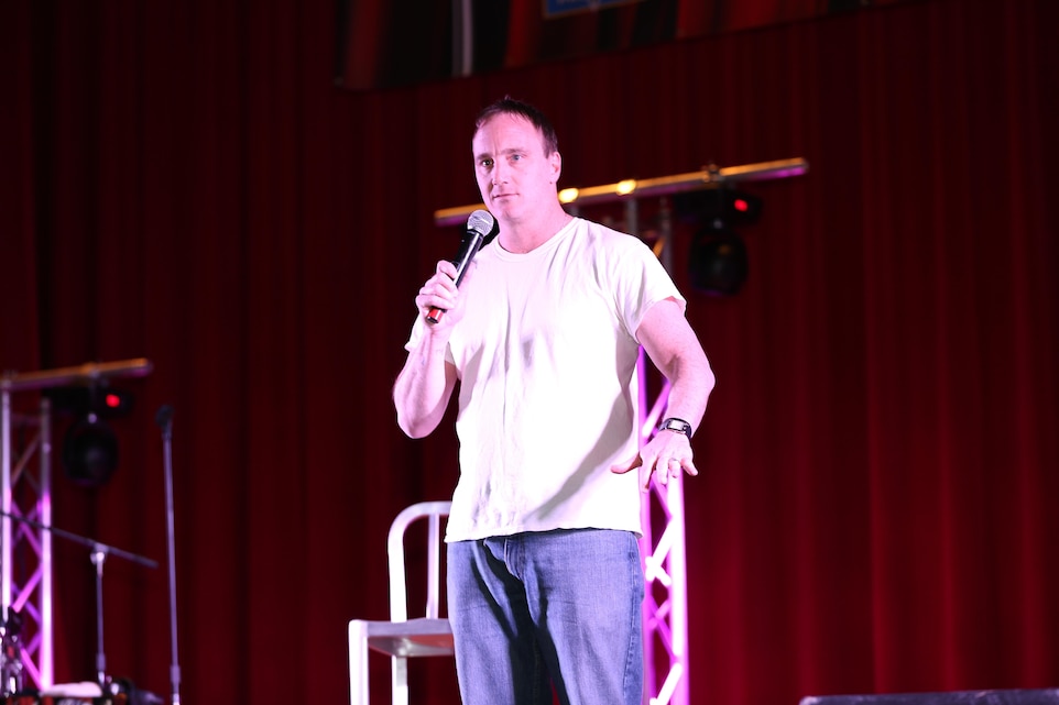 Jay Mohr, comedian, Leatherneck Comedy Tour, performs for an audience of Marines and sailors during the Leatherneck Comedy Tour at the base theater Jan. 10, 2014.