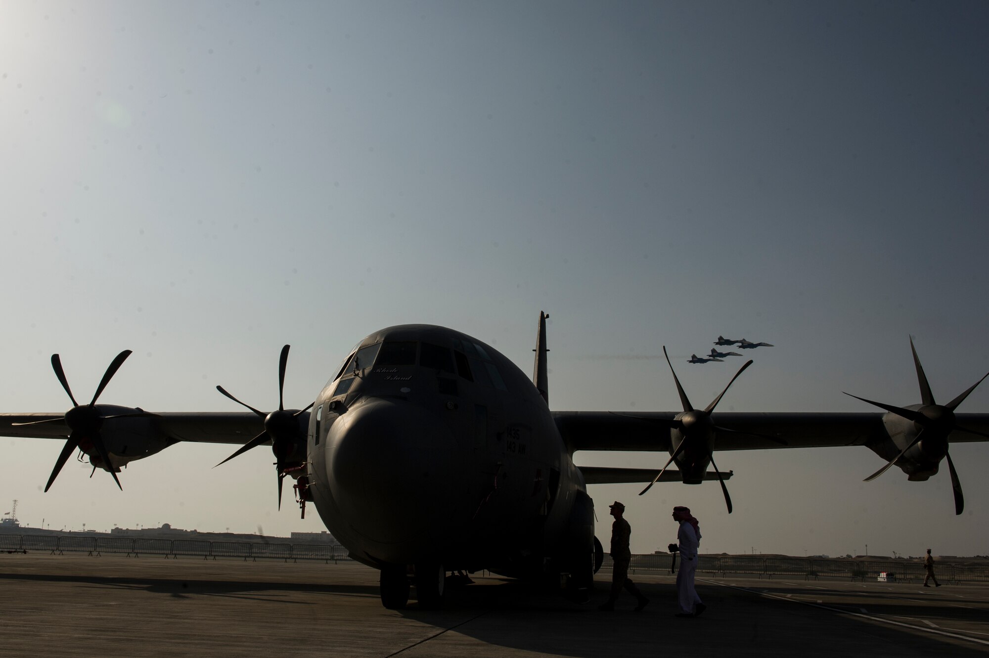 Guests attending the 2014 Bahrain International Airshow tour a U.S. Air Force C130J Super Hercules opening day at Sakhir Airbase in Manama, Bahrain, Jan. 16, 2014. The C130J and crew are deployed from the 143rd Airlift Wing, Rhode Island Air National Guard. The BIAS runs daily until the 18th of Jan.  The U.S. will support several aviation static displays. The aircraft the U.S. is showcasing through static displays is the C-130J Hercules, F-15E Strike Eagle, F-18E/F Hornet, MV-22 Osprey, and UH-1Y Huey Venom, AH-1Z Viper and MH-53E Sea Dragon helicopters.  The U.S. Air Force will also have a B-1 Lancer and F-22 Raptor flyby.  (U.S. Air Force photo by Staff Sgt. Stephany Richards)