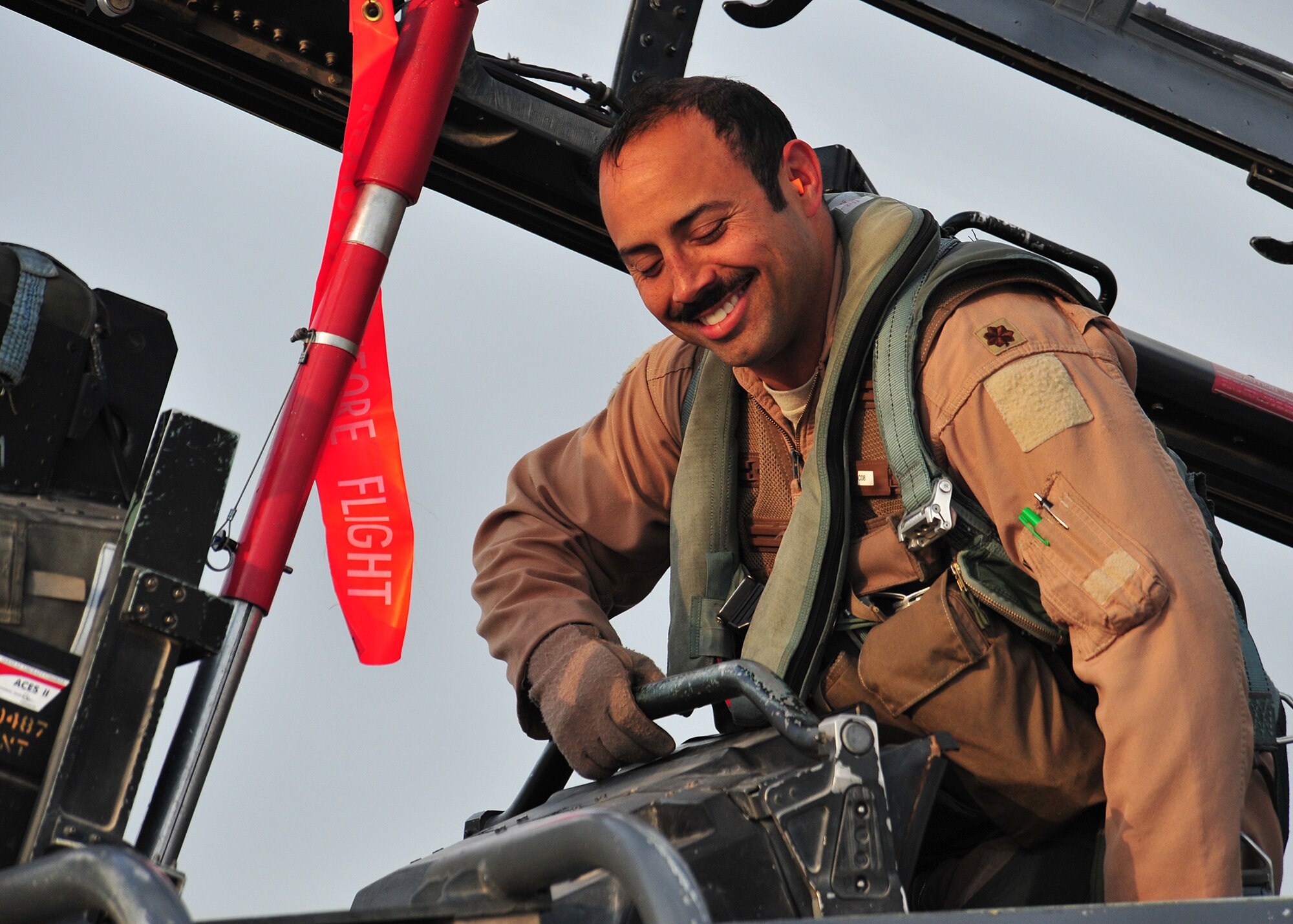 Air Force Maj. “Dozer,” 335th Expeditionary Fighter Squadron weapon systems officer,
gets out of an F-15E fighter aircraft after completing his 1,000th combat flying
hour at an undisclosed location in Southwest Asia, Jan. 12, 2014. (U.S. Air Force photo by Staff Sgt. Michael Means/Released)