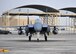 The 335th Expeditionary Fighter Squadron F-15E fighter aircraft flag ship parks after flying Air Force Maj 
