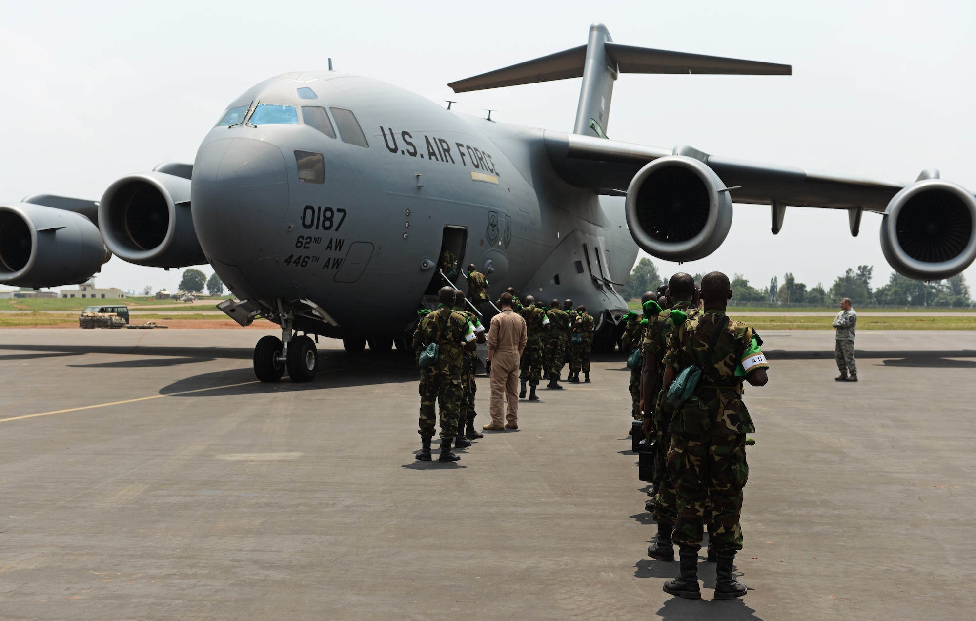 Rwandan soldiers wait in line at the Kigali airport to get on a C-17 Globemaster III based out of McChord Air Force Base, Wash., Jan. 19, 2014. U.S. forces will transport a total number of 850 Rwandan soldiers and more than 1,000 tons of equipment into the Central African Republic to aid French and African Union operations against militants during this three weeklong operation. (U.S. Air Force photo/ Staff Sgt. Ryan Crane)