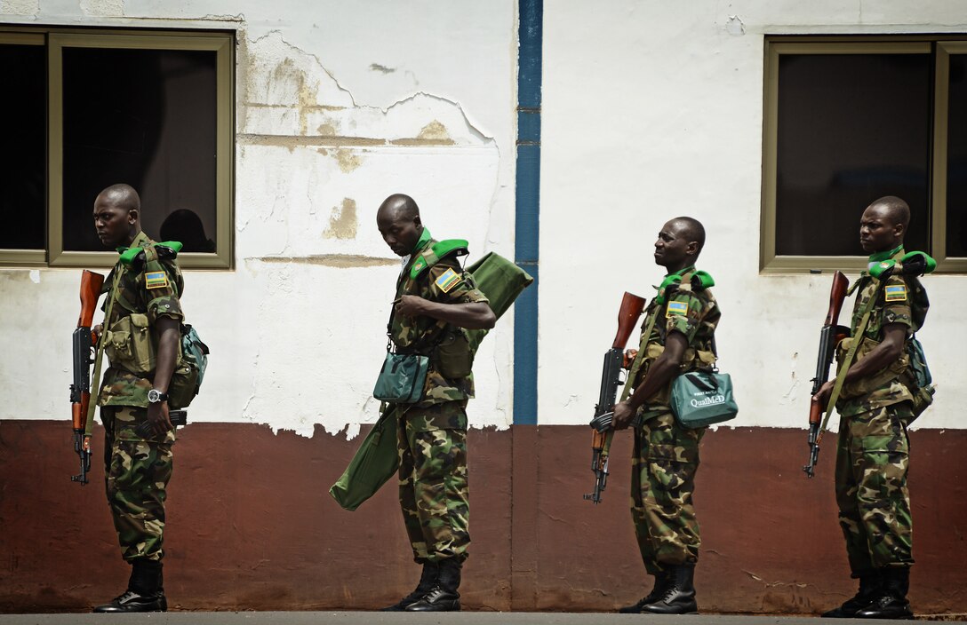 Rwandan soldiers wait in line at the Kigali airport to get on a C-17 Globemaster III, based out of McChord Air Force Base, Wash., Jan. 19, 2014. U.S. forces will transport a total number of 850 Rwandan soldiers and more than 1,000 tons of equipment into the Central African Republic to aid French and African Union operations against militants during this three weeklong operation. (U.S. Air Force photo Staff Sgt. Ryan Crane)