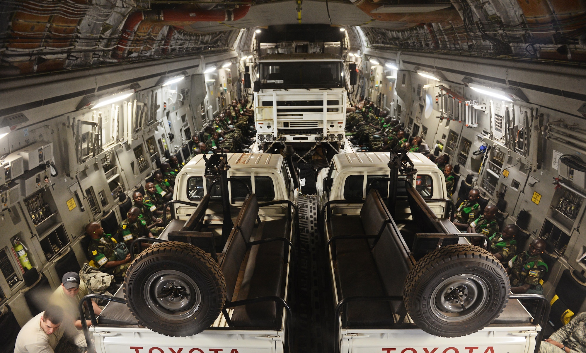 Rwandan soldiers and their equipment are flown from Rwanda to the Central Africa Republic on a C-17 Globemaster III based out of McChord Air Force Base, Wa. Jan. 19, 2014. U.S. forces will transport a total number of 850 Rwandan soldiers and more than 1000 tons of equipment into the Central African Republic to aid French and African Union operations against militants during this three week-long operation. (U.S. Air Force photo/ Staff Sgt. Ryan Crane)