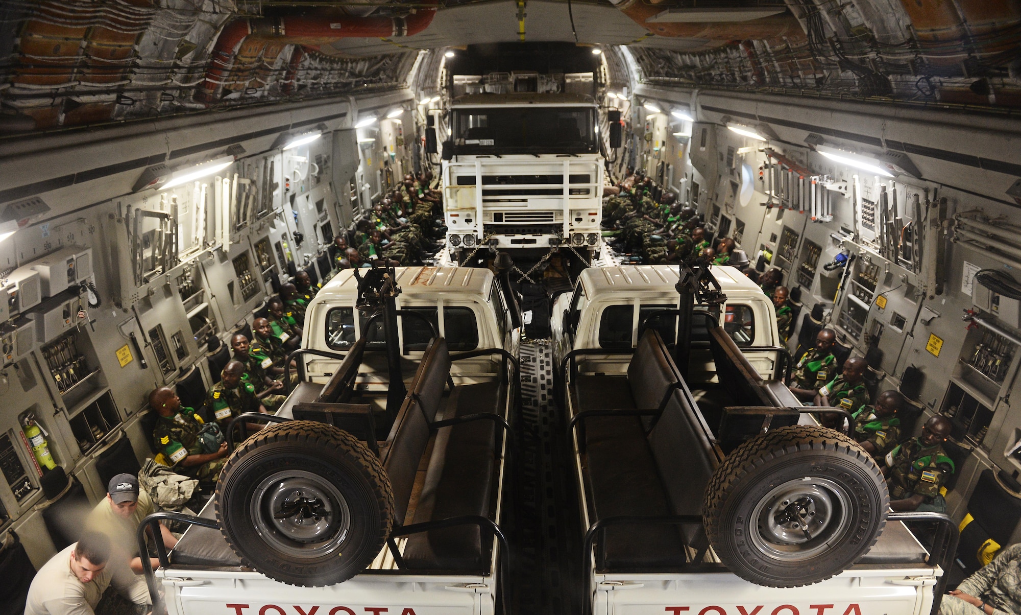 Rwandan soldiers and their equipment are flown from Rwanda to the Central Africa Republic on a C-17 Globemaster III based out of McChord Air Force Base, Wa. Jan. 19, 2014. U.S. forces will transport a total number of 850 Rwandan soldiers and more than 1000 tons of equipment into the Central African Republic to aid French and African Union operations against militants during this three week-long operation. (U.S. Air Force photo/ Staff Sgt. Ryan Crane)