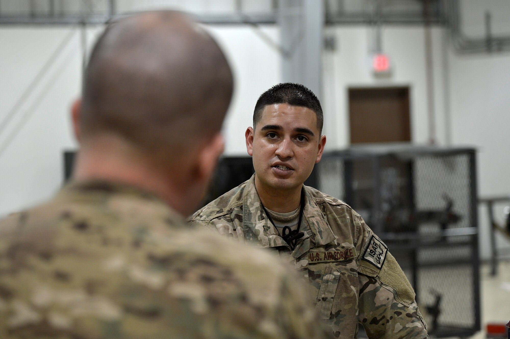 U.S. Air Force Tech. Sgt. Vincent Lopez, 83rd Expeditionary Rescue Squadron weapons expeditor, trains Airmen assigned to the 455th Expeditionary Maintenance Squadron armament shop at Bagram Airfield, Afghanistan, Jan. 19, 2014. Airmen assigned to the 455th Expeditionary Maintenance Squadron armament shop received training on the weapon systems of the HH-60G Pave Hawk from Lopez. Lopez is deployed from the 718th Aircraft Maintenance Squadron at Kadena Air Base, Japan, and is a native of El Paso, Texas. (U.S. Air Force photo by Senior Airman Kayla Newman/Released)