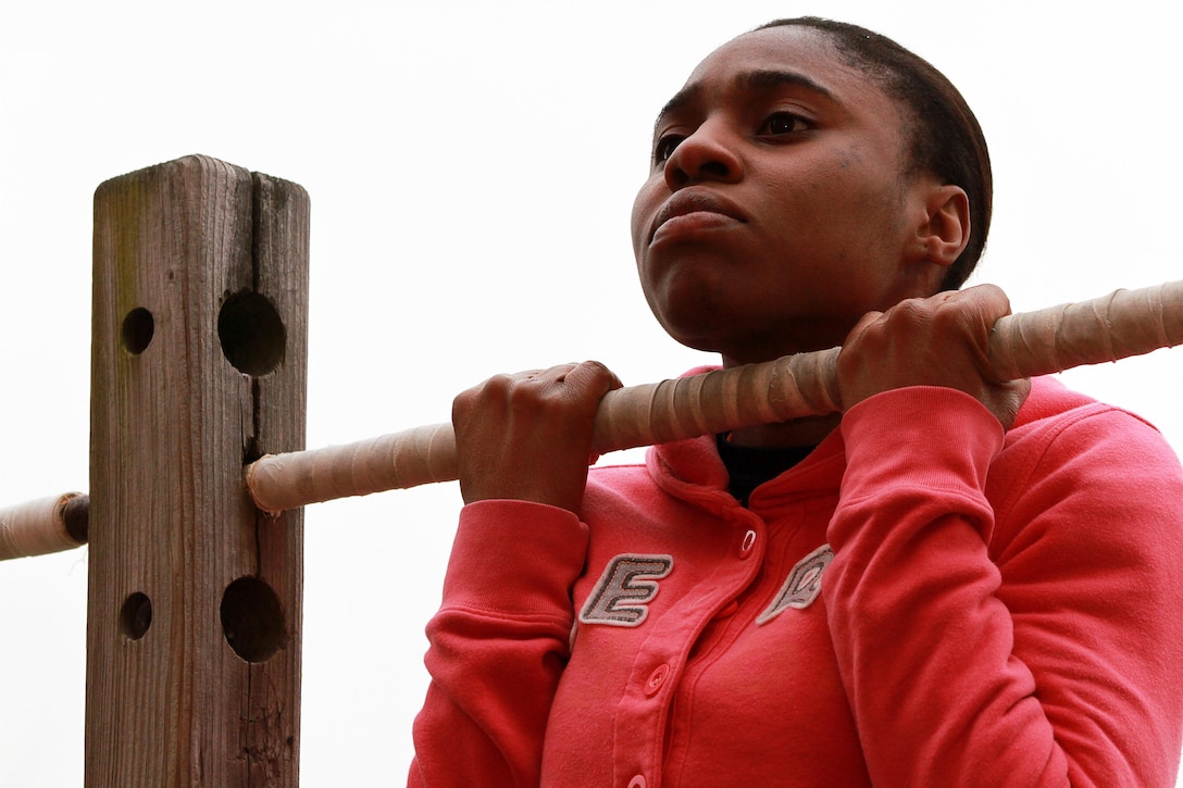 Marvica Francis, a 22-year-old who is currently enrolled in the Marine Corps’ Delayed Entry Program, performs the flexed-arm hang during a Female Pool Function on Westover Air Reserve Base, Jan 18. Francis is a poolee from Recruiting Substation Bridgeport, Recruiting Station Springfield in Western Massachusetts. (U.S. Marine Corps photo by Sgt. Richard Blumenstein).