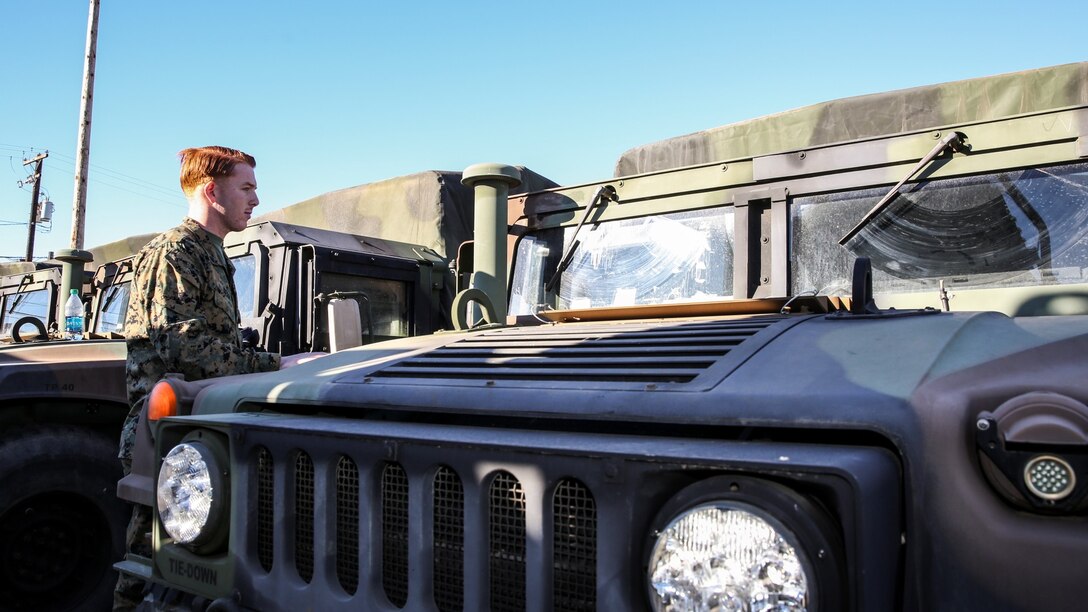 Corporal James R. Kerr, chemical, biological, radiological and nuclear defense specialist, 15th Marine Expeditionary Unit, prepares to do maintenance on a High Mobility Multipurpose Wheeled Vehicle aboard Camp Pendleton, Calif., Jan. 16, 2014. (U.S. Marine Corps photo by Cpl. Emmanuel Ramos/Released) 