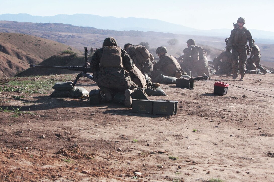 Marines feed ammunition into the browning .50 caliber machine gun during a machine gunners course aboard Camp Pendleton, Calif., Jan. 15. The course was approximately two weeks long and taught the Marines how to operate machine guns effectively.