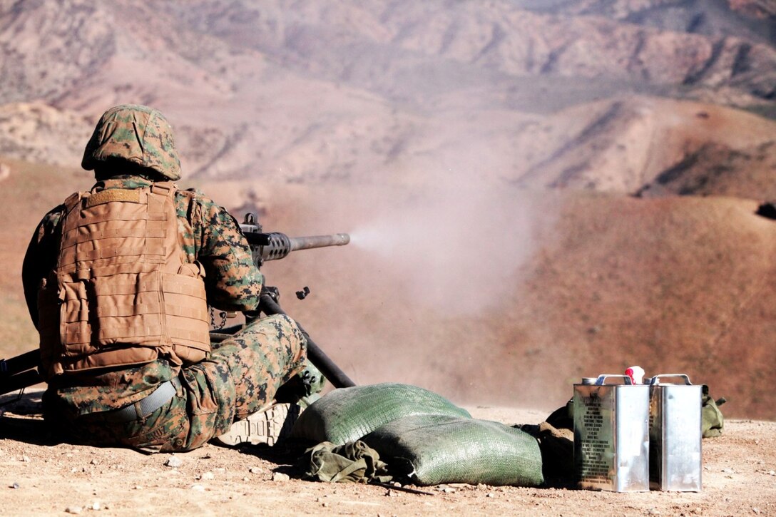 Lance Cpl. Alex Cruz, a Marine with 1st Combat Engineer Battalion, fires a Browning .50 caliber machine gun aboard Camp Pendleton, Calif., Jan. 15. The Marines fired four different machine guns during the two-week machine gunners course.