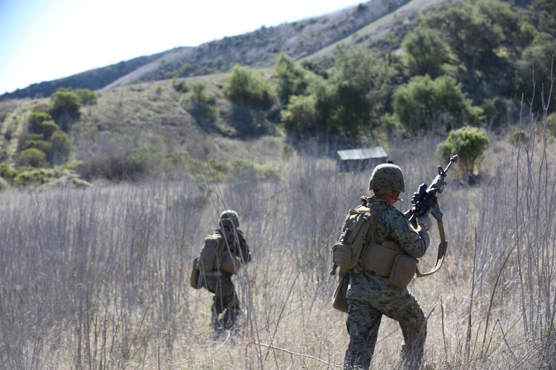 Marines from 3rd Platoon, Blackfoot Co., 3rd Light Armored Reconnaissance Battalion, move to their objective during a training exercise conducted with the Special Operations Training Group aboard Camp Pendleton, Calif., Jan. 15. The training operation was in preparation for 3/5’s deployment with the 31st Marine Expeditionary Unit.