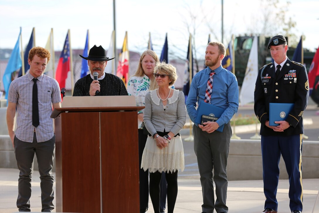 Maj. Gen. Mark A. Clark, the commanding general of Marine Corps Forces Special Operations Command, presented the Navy Cross to Russell and Marcia Mote, during a ceremony aboard Camp Pendleton, Jan. 18, 2014. Their son, Staff Sgt. Sky R. Mote, an explosive ordnance disposal technician with 1st Marine Special Operations Battalion, MARSOC, was killed in Afghanistan in 2012 when his team came under enemy fire from an Afghan uniformed police officer attacking from inside the tactical operations center. Mote, from El Dorado, Calif., exposed himself to a hail of gunfire to draw attention away from others, halting the shooter's pursuit of his comrades. He remained in the open and engaged the shooter until he fell mortally wounded.