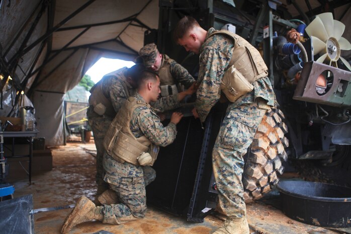 Marines maintain a 7-ton truck Jan. 14 during the Winter Workhorse field exercise at the Central Training Area. The Marines are with Combat Logistics Regiment 3, 3rd Marine Logistics Group, III Marine Expeditionary Force.


