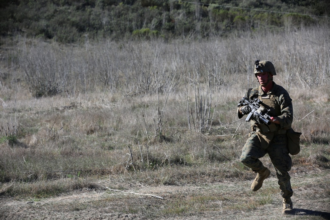 Cpl. Connor Hall, team leader with 3rd Platoon, Blackfoot Co., 3rd Light Armored Reconnaissance Battalion, rushes to meet fellow Marines to conduct tactical site exploitation on their objective. The raid was conducted by the Special Operations Training Group aboard Camp Pendleton, Calif., Jan. 15.