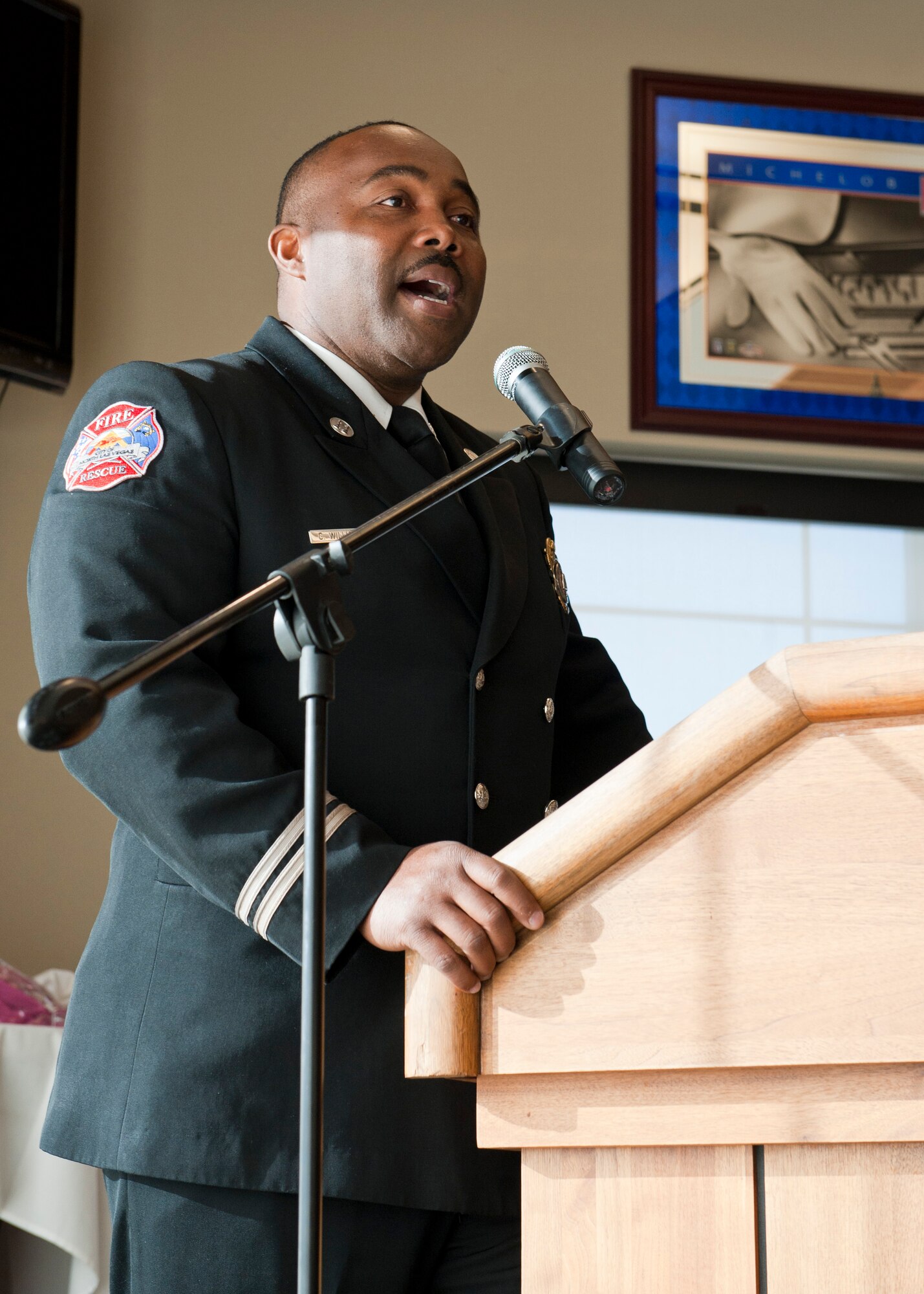 North Las Vegas Fire Department Public Information and Community Liaison Officer, Capt. Cedric Williams, speaks at the Dr. Martin Luther King, Jr. remembrance breakfast at the golf course Jan. 17, 2014, at Nellis Air Force Base, Nev. The purpose of the breakfast was to remember the legacy of Dr. King. (U.S. Air Force photo by Airman 1st Class Thomas Spangler)