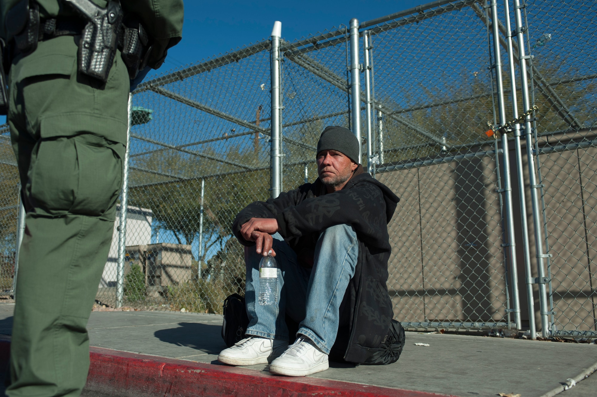 Terry Smith, a homeless man, waits to find out if there is space available in a local detox center while Aden Ocampogomez, Las Vegas Metropolitan Police Department police officer, calls in to request the slot for him Jan. 14, 2014, in Las Vegas. Drug and alcohol abuse are a growing problem amongst the Las Vegas homeless community. (U.S. Air Force photo by Airman 1st Class Timothy Young)