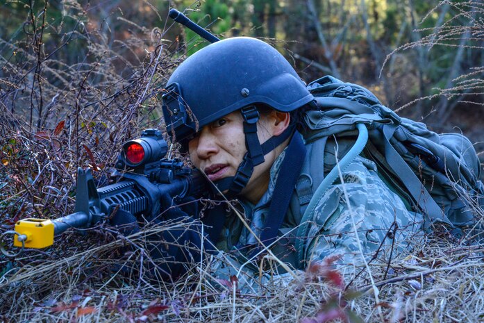 Maj. Mindy Yu, 1st Combat Camera Squadron officer, provides security during the Ability to Survive and Operate exercise Jan. 14, 2014, at North Auxiliary Air Field, S.C. The exercise was organized to sharpen Airmen’s skills and their ability to operate as combat documentation specialists outside the wire. (U.S. Air Force photo/ Airman 1st Class Clayton Cupit)