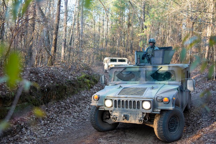Airman 1st Class Daniel Johnston, 1st Combat Camera Squadron broadcaster, mans the turret position on a Humvee with an M-4 carbine rifle scanning for IED’s or enemy forces during the Ability to Survive and Operate exercise Jan. 17, 2014, at North Auxiliary Air Field, S.C. The 1st Combat Camera Squadron located at Joint Base Charleston, S.C., hosted the Ability to Survive and Operate Exercise from Jan. 6 through 17.  (U.S. Air Force photo/ Airman 1st Class Clayton Cupit)