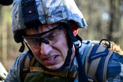 Senior Airman Roswell Sartwell, 3rd Combat Camera Squadron broadcaster, discusses navigation routes with his team during the Ability to Survive and Operate exercise Jan. 14, 2014, at North Auxiliary Air Field, S.C. The exercise was organized to sharpen Airmen’s skills and their ability to operate as combat documentation specialists outside the wire. (U.S. Air Force photo/ Airman 1st Class Clayton Cupit)