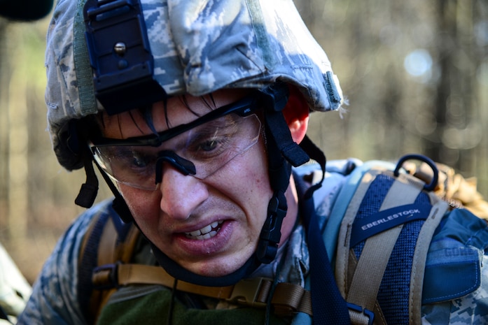 Senior Airman Roswell Sartwell, 3rd Combat Camera Squadron broadcaster, discusses navigation routes with his team during the Ability to Survive and Operate exercise Jan. 14, 2014, at North Auxiliary Air Field, S.C. The exercise was organized to sharpen Airmen’s skills and their ability to operate as combat documentation specialists outside the wire. (U.S. Air Force photo/ Airman 1st Class Clayton Cupit)