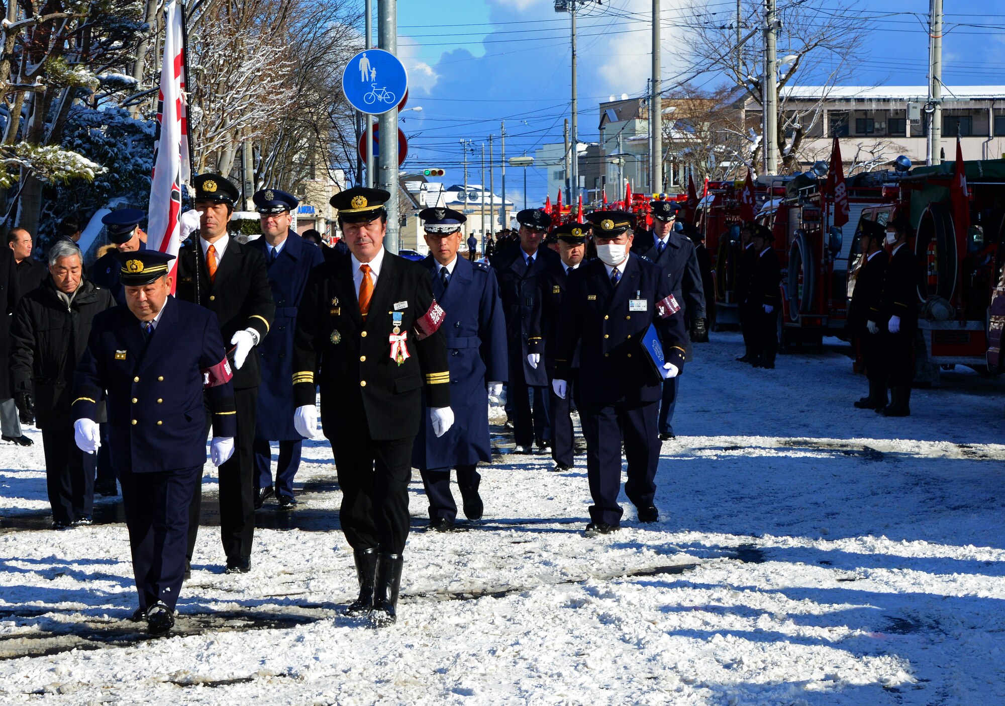 Local city and base officials inspect city and base fire trucks during the annual Misawa Fire Department New Year ceremony in Misawa City, Japan, Jan. 19, 2014. "Their hard work and dedication helps ensure the safety of everyone living in and around Misawa City," said Col. Stephen Williams, 35th Fighter Wing commander. (U.S. Air Force photo by Tech. Sgt. April Quintanilla)