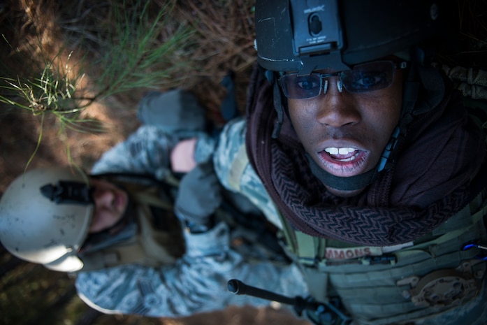 Capt. Jonathan Simmons, 1st Combat Camera Squadron photo flight commander, has a tourniquet wrapped around his arm after receiving a simulated gunshot wound. Medical personnel administered the Self-Aid Buddy Care portion of the Ability to Survive and Operate exercise Jan. 15, 2014, at North Auxiliary Air Field, S.C. The 1st Combat Camera Squadron located at Joint Base Charleston, S.C., hosted the Ability to Survive and Operate Exercise from Jan. 6 through 17. (U.S. Air Force photo/ Senior Airman Dennis Sloan)
