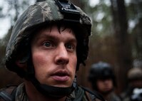Senior Airman Roswell Sartwell, 3rd Combat Camera Squadron broadcaster, is covered in sweat and rain after his team came under fire during a patrol in the tactical portion of the Ability to Survive and Operate exercise Jan. 14, 2014, at North Auxiliary Air Field, S.C. The 1st Combat Camera Squadron located at Joint Base Charleston, S.C., hosted the Ability to Survive and Operate Exercise from Jan. 6 through 17. (U.S. Air Force photo/ Senior Airman Dennis Sloan)