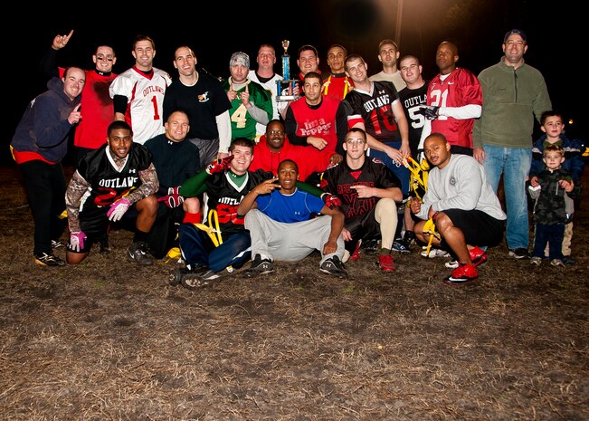 Football players from the 628th Civil Engineer Squadron celebrate after winning Intramural Flag Football Championship, Jan. 17, 2014 at Joint Base Charleston – Air Base, S.C. CES beat the 628th Force Support Squadron 13-12 to win back-to-back championships. (U.S. Air Force photo/Staff Sgt. William O’Brien)