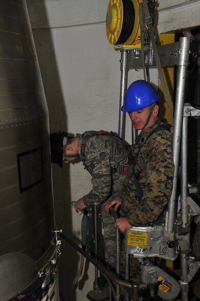 Marine Corps Sgt. Maj. Bryan Battaglia, Senior Enlisted Advisor to the Chairman of the Joint Chiefs of Staff, visited Minot Air Force Base January 13-15, 2014, to personally visit with Airmen of both the 5th Bomb Wing and 91st Missile Wing to learn more about their day-to-day contributions to the nuclear deterrence mission.  Battaglia is charged with advising the CJCS on all matters involving joint and combined total force integration, utilization, health of the force and joint development for enlisted personnel.  (U.S. Air Force photos/ Senior Airman Kristoffer Kaubisch and Airman 1st Class Lauren Pitts) 