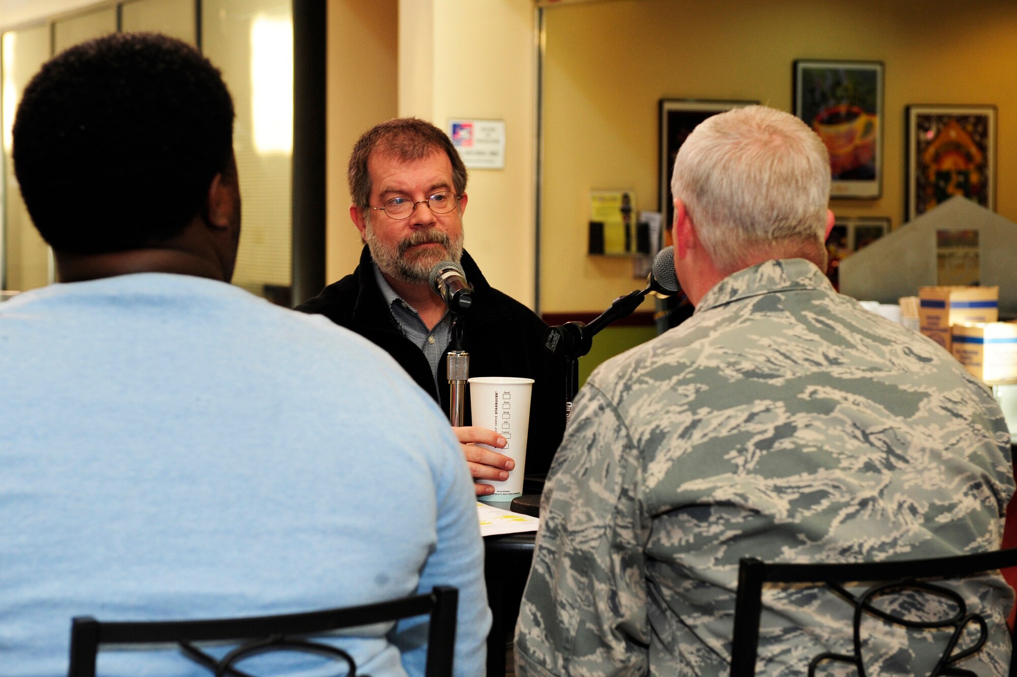 Derek Burress, the host of the Good Morning Sumter radio show, interviews Chaplain (Maj.) Richard Holmes, 20th Fighter Wing chaplain, on Good Morning Sumter with the help of Eric McKnight, the Good Morning Sumter executive producer and co-host, at Shaw Air Force Base, S.C., Jan. 17, 2014. The Good Morning Sumter show comes on base to interview military personnel to keep the public informed of events and the Air Force mission on base. (U.S. Air Force photo by Airman 1st Class Diana M. Cossaboom/Released)