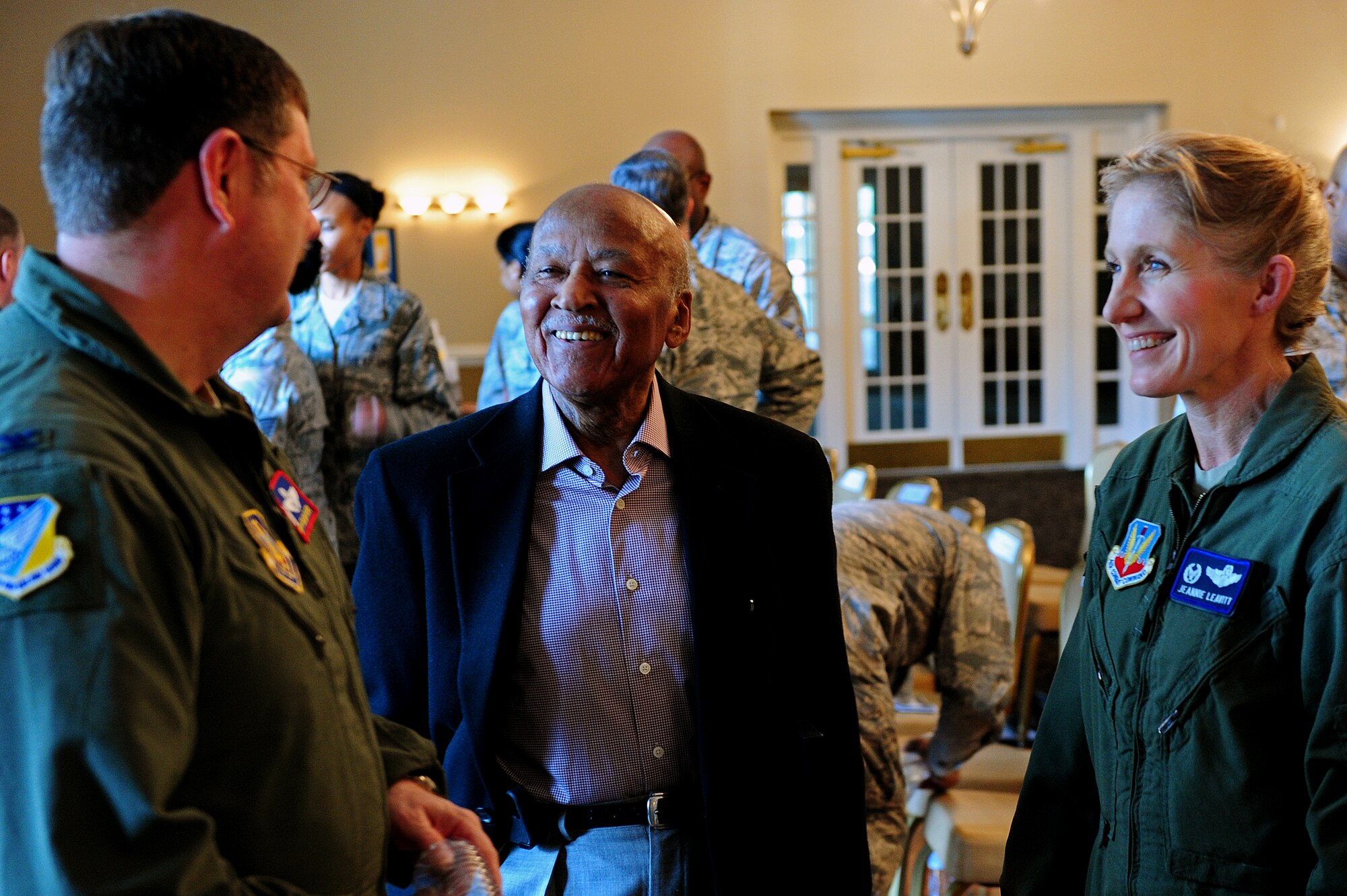 Col. Gregory Gilmour, 916th Air Refueling Wing commander, the mayor of Goldsboro, Al King, and Col. Jeannie Leavitt, 4th Fighter Wing commander, talk after the annual Martin Luther King Jr. Day Celebration Ceremony at Heritage Hall, Jan. 17, 2014.  The ceremony featured three guest speakers as well as volunteer Airmen reciting prominent lines from Dr. King’s speech.  (U.S. Air Force photo by Airman 1st Class Brittain Crolley)