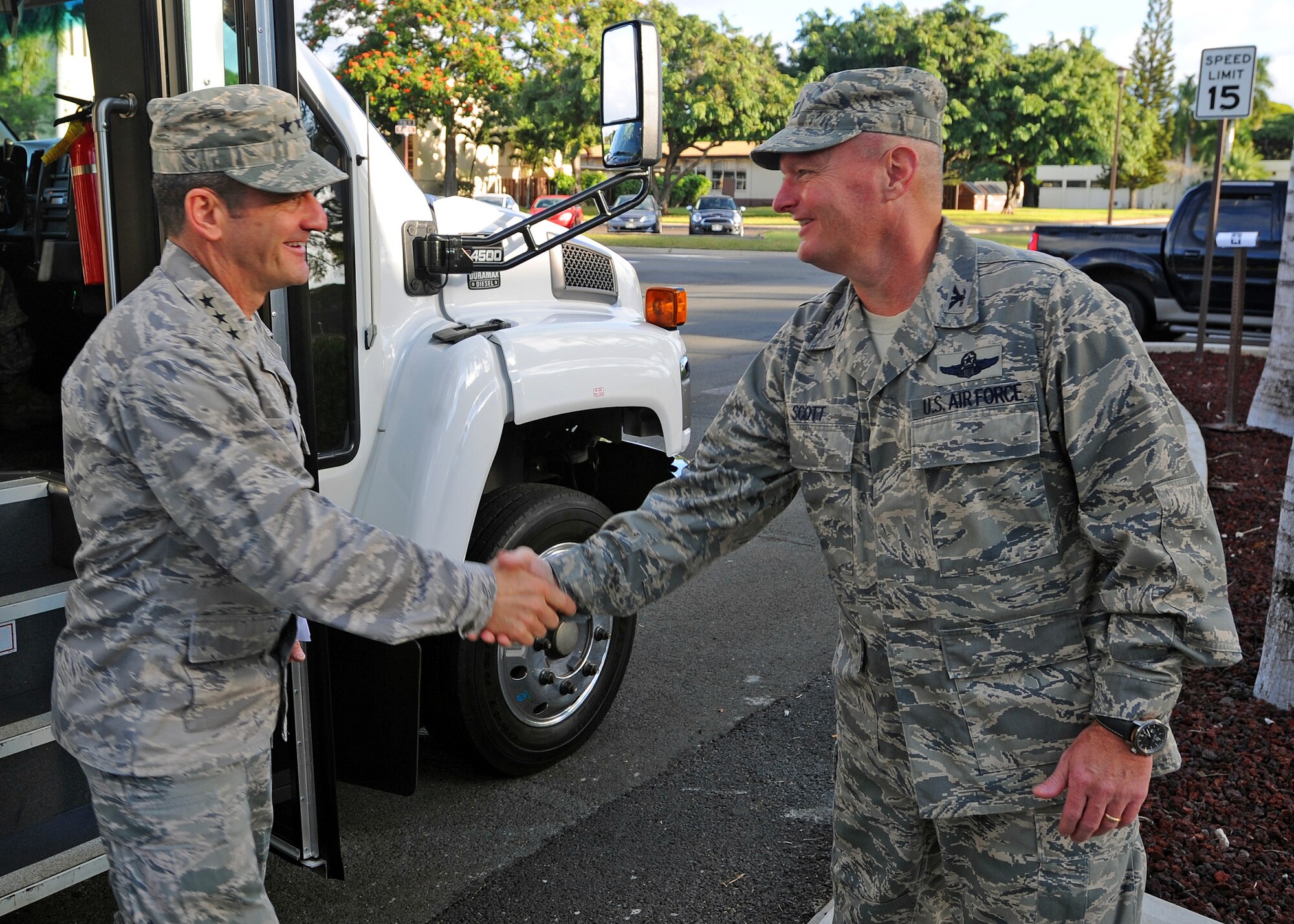 Lt. Gen. Russell Handy, 11th Air Force commander, greeted by Col. Terry Scott, 15th Wing vice commander, shortly after his arrival, during a visit to the 15th Wing headquarters, Joint Base Pearl-Harbor Hickam, Hawaii, Jan. 21, 2014.  Handy visited the wing to meet with JBPHH Airmen and for a familiarization base tour of JBPHH's unique operations. (U.S. Air Force photo/Master Sgt. Jerome S. Tayborn)