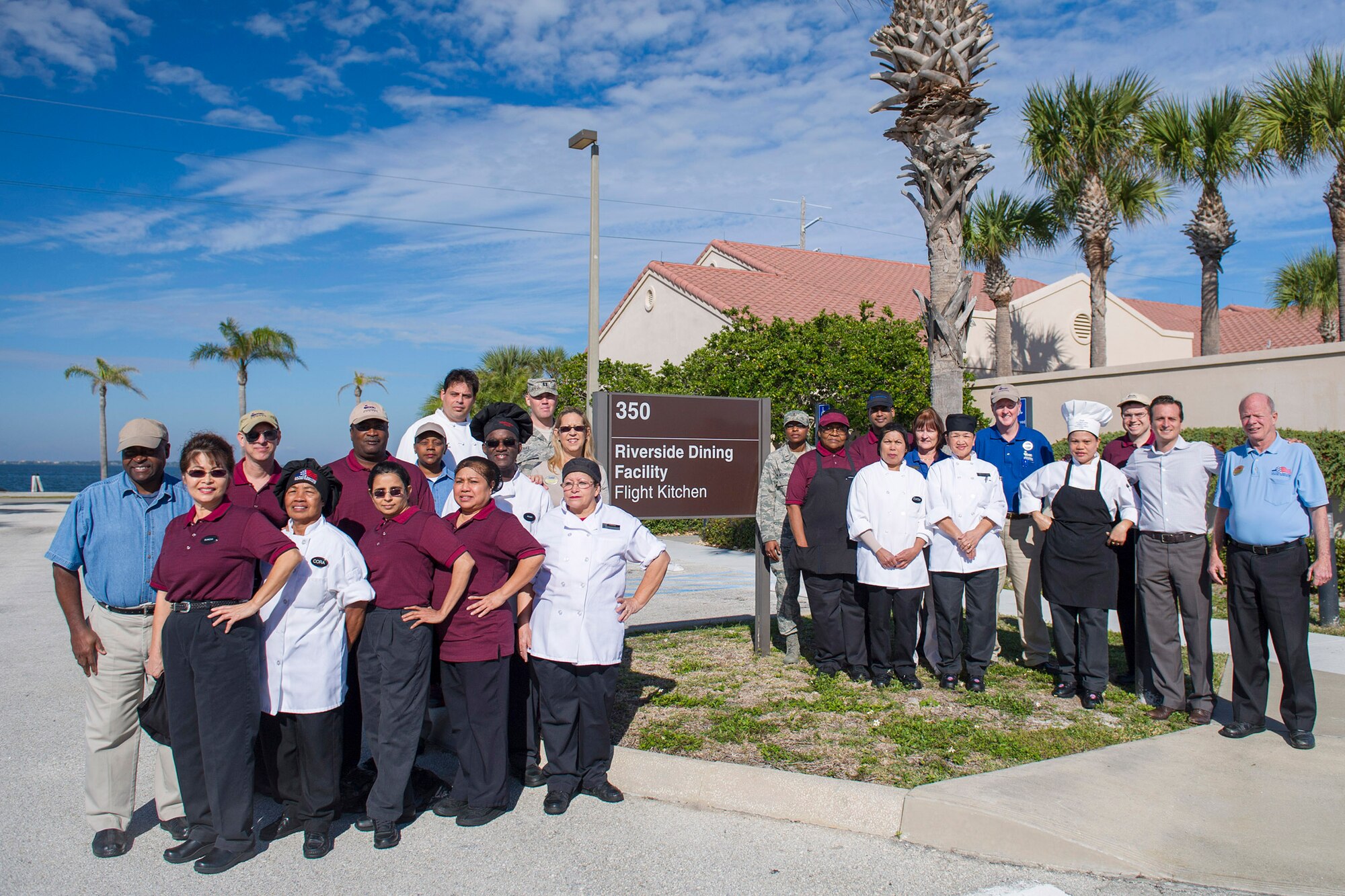 Members of the Riverside Dining Facility and Aramark pose outside of the Patrick Air Force Base, Fla., Riverside Dining Facility Jan. 21. The Riverside Dining Facility was named the 2014 John L. Hennessy Award nominee for Air Force Space Command and will compete at the Air Force level in the installation category. The Hennessy Team evaluates the quality of the staff and facility on food service, kitchen operations, serving and dining operations, sanitation, repair maintenance, personnel training, readiness and management. (U.S. Air Force photo/Matthew Jurgens)