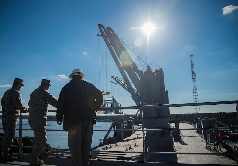 (Left to right) Chief Master Sgt. Mark Bronson, 618th Air Base Wing command chief, Col. Jeffrey DeVore, Joint Base Charleston commander and Edward Pillet, Pomeroy deck officer, stand on the deck of the USNS Pomeroy (T-AKR 316), Jan. 16, 2013, at Joint Base Charleston – Weapons Station, S.C. The ship’s decks has ample space for lashing down tanks, helicopters, trucks and other large vehicles for prepositioning U.S. military equipment and supplies during wartime and other national contingencies. (U.S. Air Force photo / Senior Airman Tom Brading)