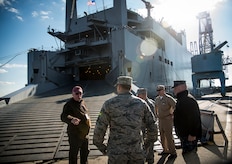 Tom D’Agostino, Military Sealift Command - Atlantic Detachment (left), welcomes Joint Base Charleston leadership onboard the USNS Pomeroy (T-AKR 316) for a tour Jan. 16, 2013, at Joint Base Charleston – Weapons Station, S.C. The Pomeroy is a 950-foot-long, medium-speed, roll on/roll off cargo ship with a crew of 30, used for prepositioning U.S. military combat equipment and combat support equipment needed overseas, and for resupplying U.S. armed forces with vital equipment during an international crisis. (U.S. Air Force photo / Senior Airman Tom Brading)