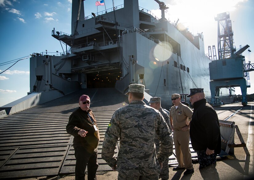 Tom D’Agostino, Military Sealift Command - Atlantic Detachment (left), welcomes Joint Base Charleston leadership onboard the USNS Pomeroy (T-AKR 316) for a tour Jan. 16, 2013, at Joint Base Charleston – Weapons Station, S.C. The Pomeroy is a 950-foot-long, medium-speed, roll on/roll off cargo ship with a crew of 30, used for prepositioning U.S. military combat equipment and combat support equipment needed overseas, and for resupplying U.S. armed forces with vital equipment during an international crisis. (U.S. Air Force photo / Senior Airman Tom Brading)