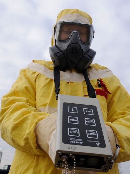 Senior Airman Raymond Reidenbach, 509th Civil Engineer Squadron emergency management support team member, uses an ADM-300 instrument to detect possible radiation hazards during an inspection at Whiteman Air Force Base, Mo., Jan. 11, 2014. Reidenbach was the beta/gamma monitor during the inspection.  (U.S. Air Force photo by Staff Sgt. Alexandra M. Boutte/Released)