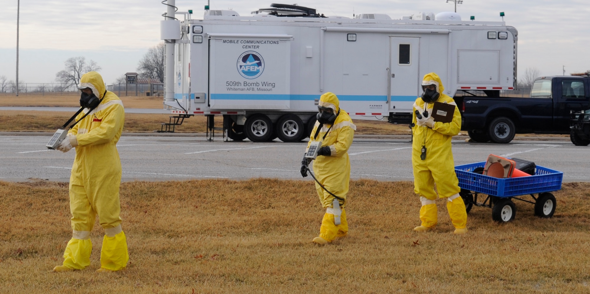 Senior Airman Raymond Reidenbach, Senior Airman Aaron Avila and Staff Sgt.
Rebecca Buhrman, 509th Civil Engineer Squadron emergency management
support team members, conduct part of a three-legged survey team exercise
in which they looked for potential areas of radioactive contamination during an
inspection at Whiteman Air Force Base, Mo., Jan. 11, 2014. (U.S. Air Force photo by Staff Sgt. Alexandra M. Boutte/Released)