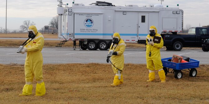 Senior Airman Raymond Reidenbach, Senior Airman Aaron Avila and Staff Sgt.
Rebecca Buhrman, 509th Civil Engineer Squadron emergency management
support team members, conduct part of a three-legged survey team exercise
in which they looked for potential areas of radioactive contamination during an
inspection at Whiteman Air Force Base, Mo., Jan. 11, 2014. (U.S. Air Force photo by Staff Sgt. Alexandra M. Boutte/Released)