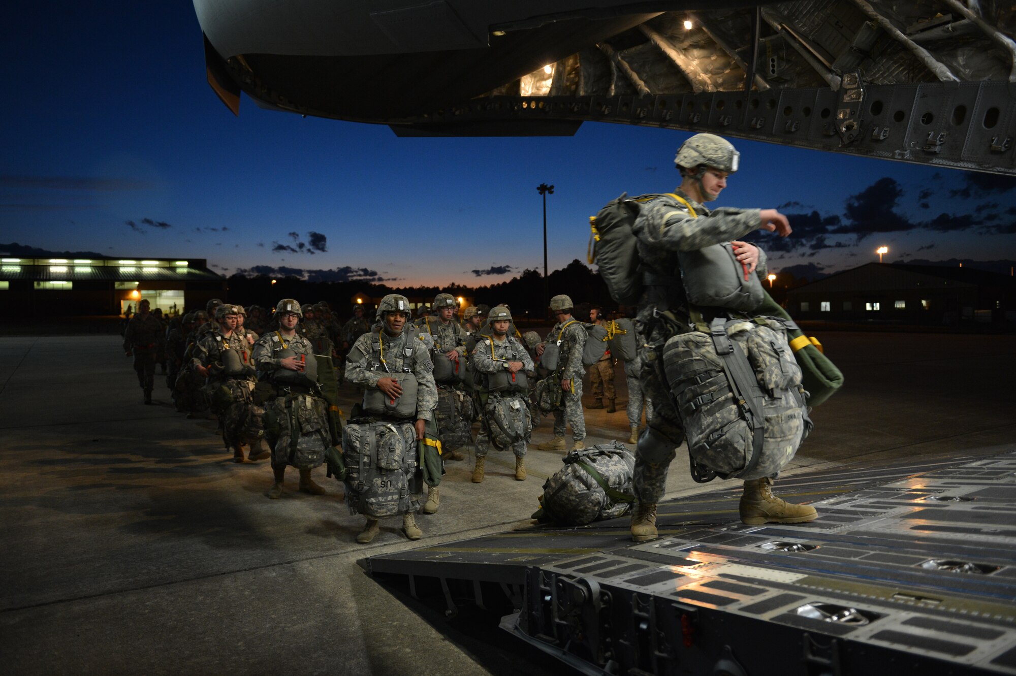 Paratroopers from the 82nd Airborne Division load onto a C-17 Globemaster III aircraft at the start of the joint forcible entry operations during Global Response Expeditor, Jan. 15, 2014, at Pope Army Air Field, N.C. More than 1,200 Army paratroopers and more than 800 Airmen participated in GRE, gaining JFE experience while also keeping up with their specific jump qualifications. (U.S. Air Force photo/Staff Sgt. Jason Truskowski)