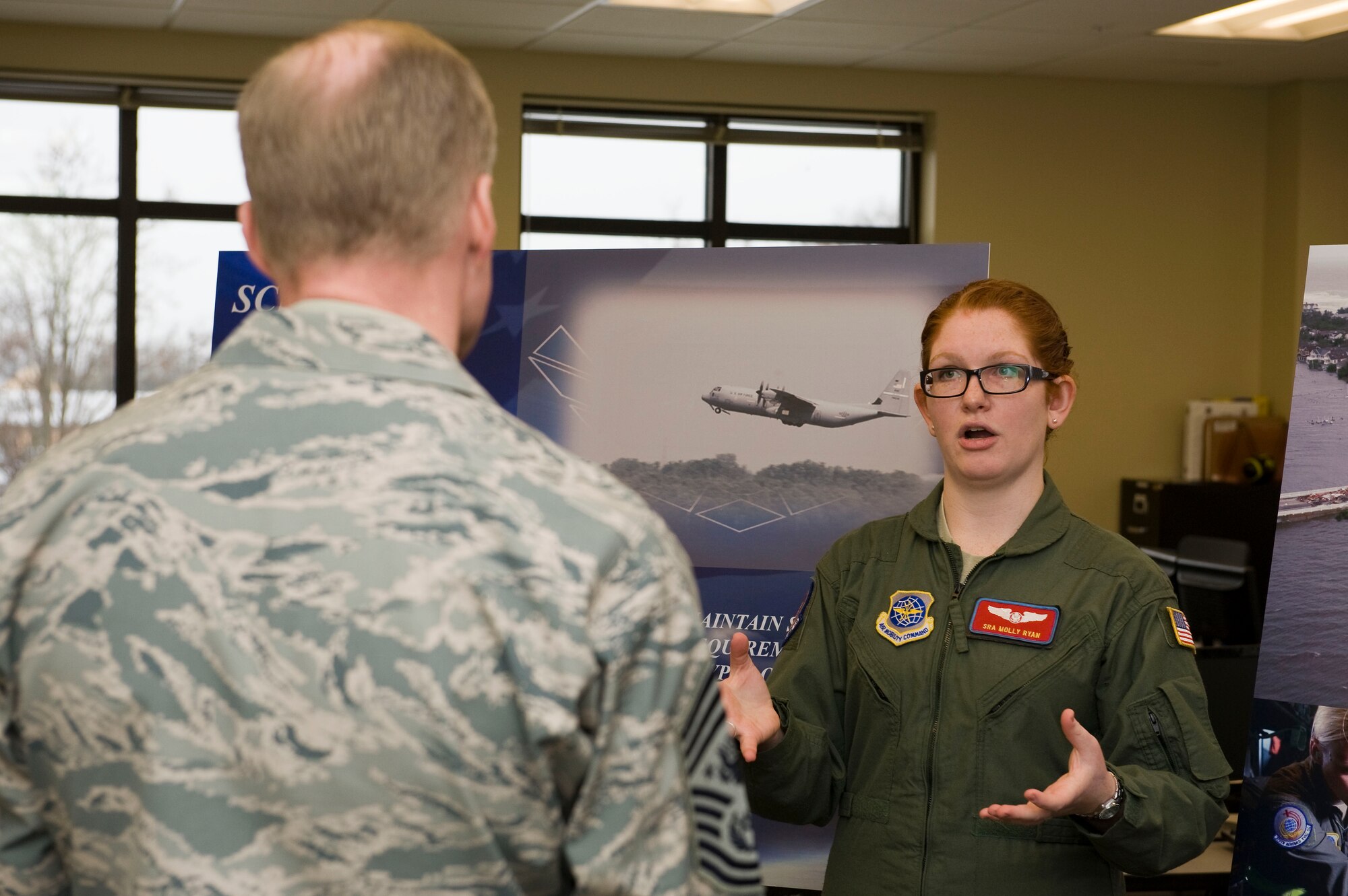 Senior Airman Molly Ryan briefs Chief Master Sgt. of the Air Force James A. Cody on the 375th Aeromedical Evacuation Squadron Jan. 17, 2014, at Scott Air Force Base, Ill. Cody was given a tour of the 375th AES facility, briefed on their mission capabilities and provided a demonstration of some of their training equipment and procedures. Ryan is a member of the 375th AES. (U.S. Air Force photo/Staff Sgt. Jonathan Fowler)