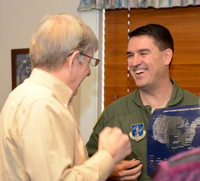 U.S Air Force Lt. Col. John Verhage, 116th Operations Group deputy commander, Georgia Air National Guard, laughs with a member of the Centerville Rotary Club, Warner Robins, Ga., Jan. 14, 2014. Verhage spoke to the club about the mission and successes of the Joint STARS 116th Air Control Wing, stationed at Robins Air Force Base, Ga., and the Georgia National Guard.  (U.S. Air National Guard photo by Tech. Sgt. Regina Young/Released)