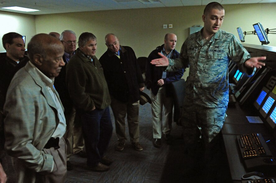 Senior Airman Andrew Shepard, 4th Operation Support Squadron air traffic controller, shows off the squadron’s high-tech radar system during a tour at Seymour Johnson Air Force Base, N.C., Jan. 15, 2014.  4th Fighter Wing leaders and community dignitaries toured the new radar approach control facility to see final product of a project decades in the making.  (U.S. Air Force photo by Airman 1st Class Brittain Crolley)