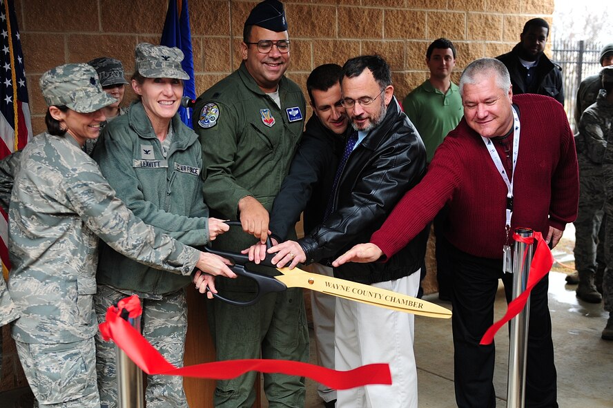 4th Fighter Wing leaders, community dignitaries and key project advisors cut the ribbon during a ceremony at Seymour Johnson Air Force Base, N.C., Jan. 15, 2014.  The ceremony marked the official opening of the 4th Operation Support Squadron’s new radar approach control facility.  (U.S. Air Force photo by Airman 1st Class Brittain Crolley)