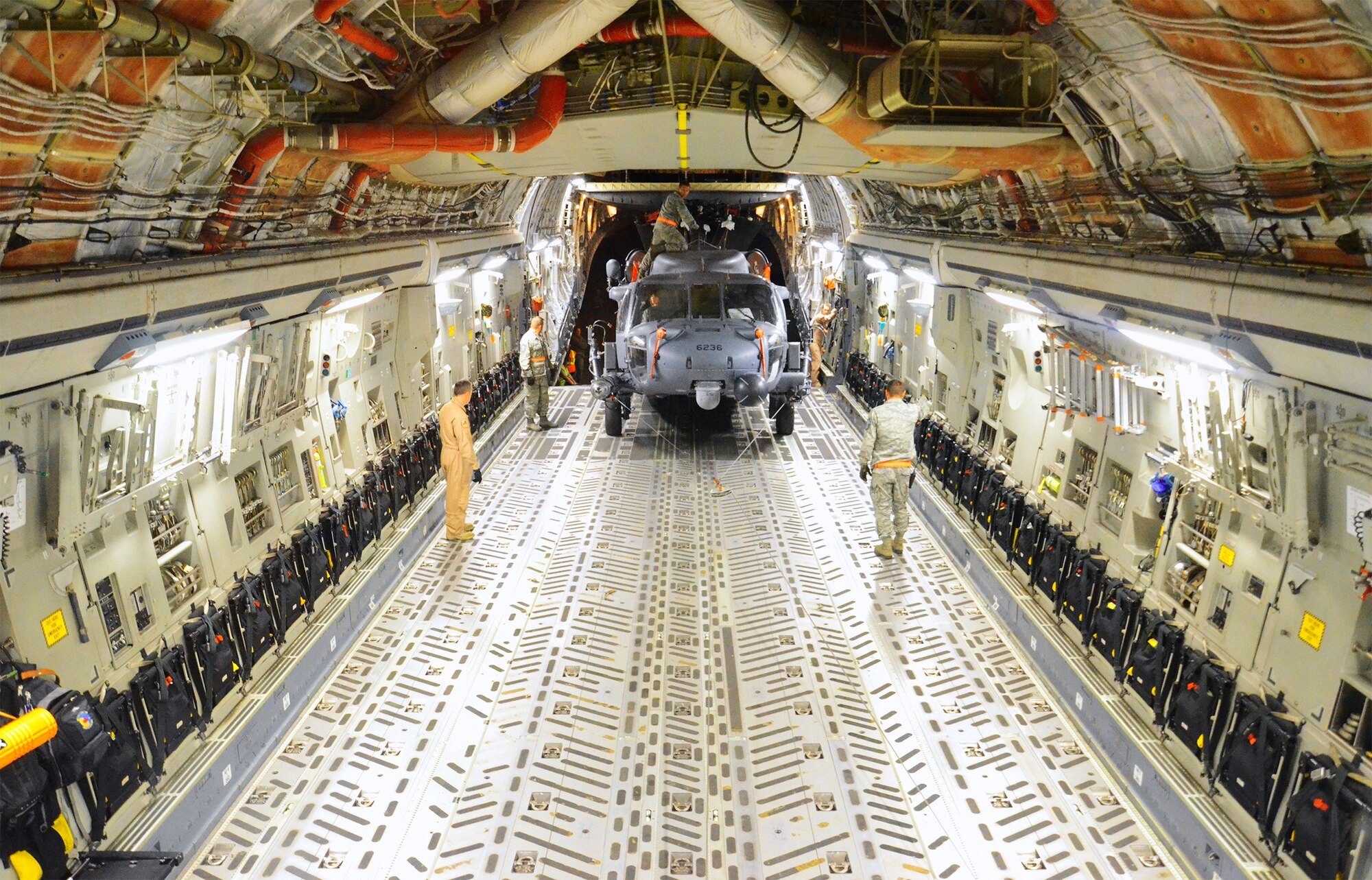 One of the 920th Rescue Wing's HH-60G Pave Hawk helicopters being loaded onto a C-17 Globemaster III for deployment to the Horn of Africa. The C-17 and its crew are based out of Joint Base Charleston, S.C. (U.S. Air Force photo/Master Sgt. Paul Flipse)
