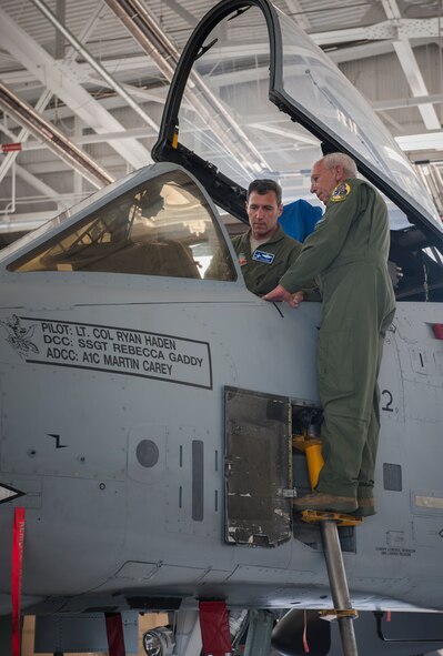 U.S. Air Force Lt. Col. Ryan Haden, left, 74th Fighter Squadron commander, shows his father, retired Col. Robert Haden, the inside of an A-10C Thunderbolt II cockpit at Moody Air Force Base, Ga., Oct. 31, 2013. Robert Haden was also an A-10 pilot during his 28 years in the Air Force. (U.S. Air Force photo by Airman 1st Class Alexis Millican/Released)