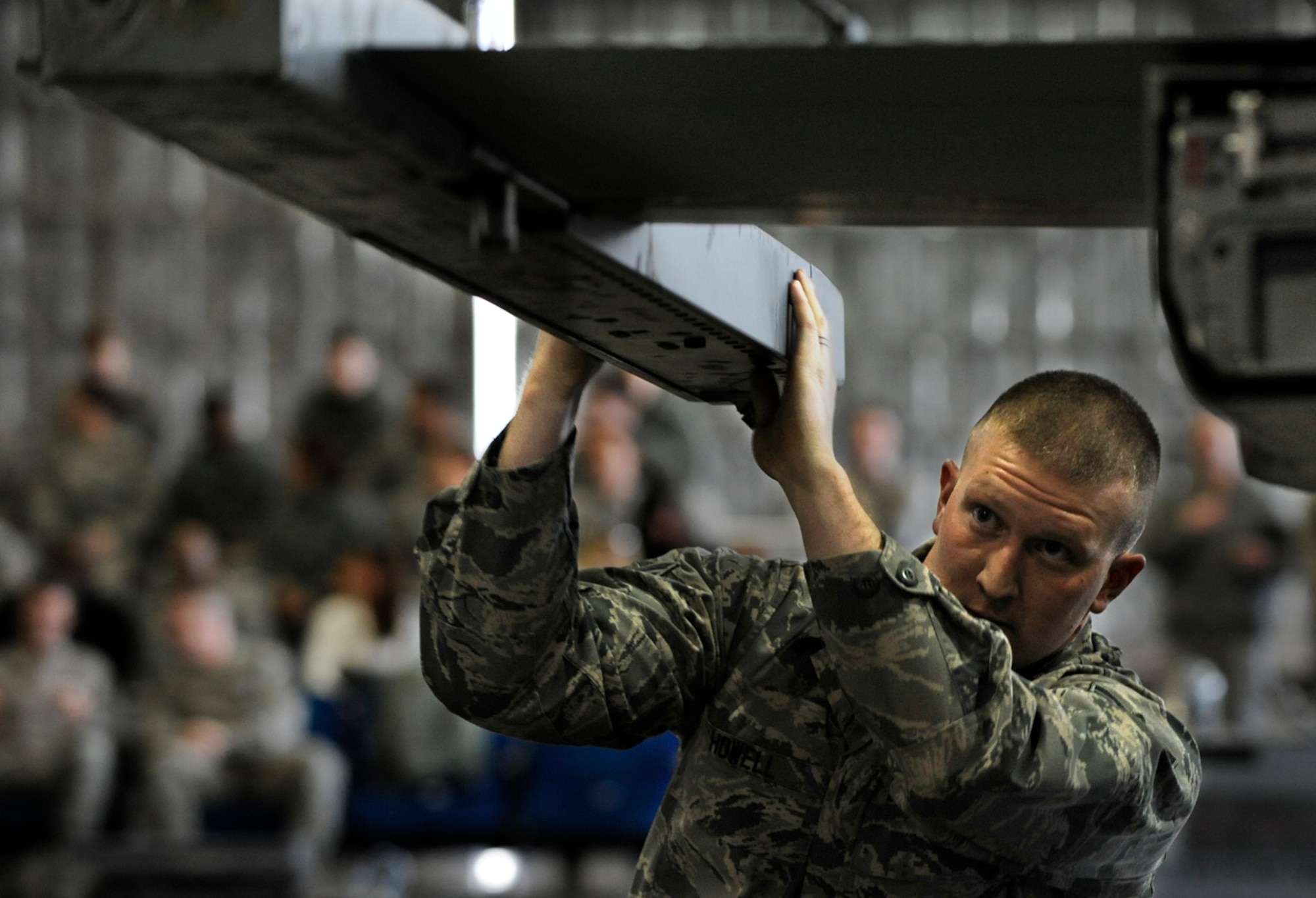 Airman 1st Class Michael Howell, member of the 13th Aircraft Maintenance Unit weapons load crew, checks the armament alignment on the F-16 his crew is working on during the Weapons Load Crew of the Year competition at Misawa Air Base, Japan, Jan 17. 2014.  Howell’s team loaded a total of four armaments onto the aircraft. The winning unit will be announced in March. (U.S. Air Force photo/Airman 1st Class Patrick S. Ciccarone)
