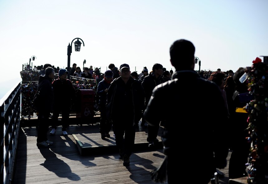 People walk around the platforms at N Seoul Tower Jan. 18, 2014, in Seoul, Republic of Korea. The N Seoul Tower contains the highest vantage point in Seoul and several platforms to view the city and its surrounding mountains from. (U.S. Air Force photo by Staff Sgt. Jake Barreiro)