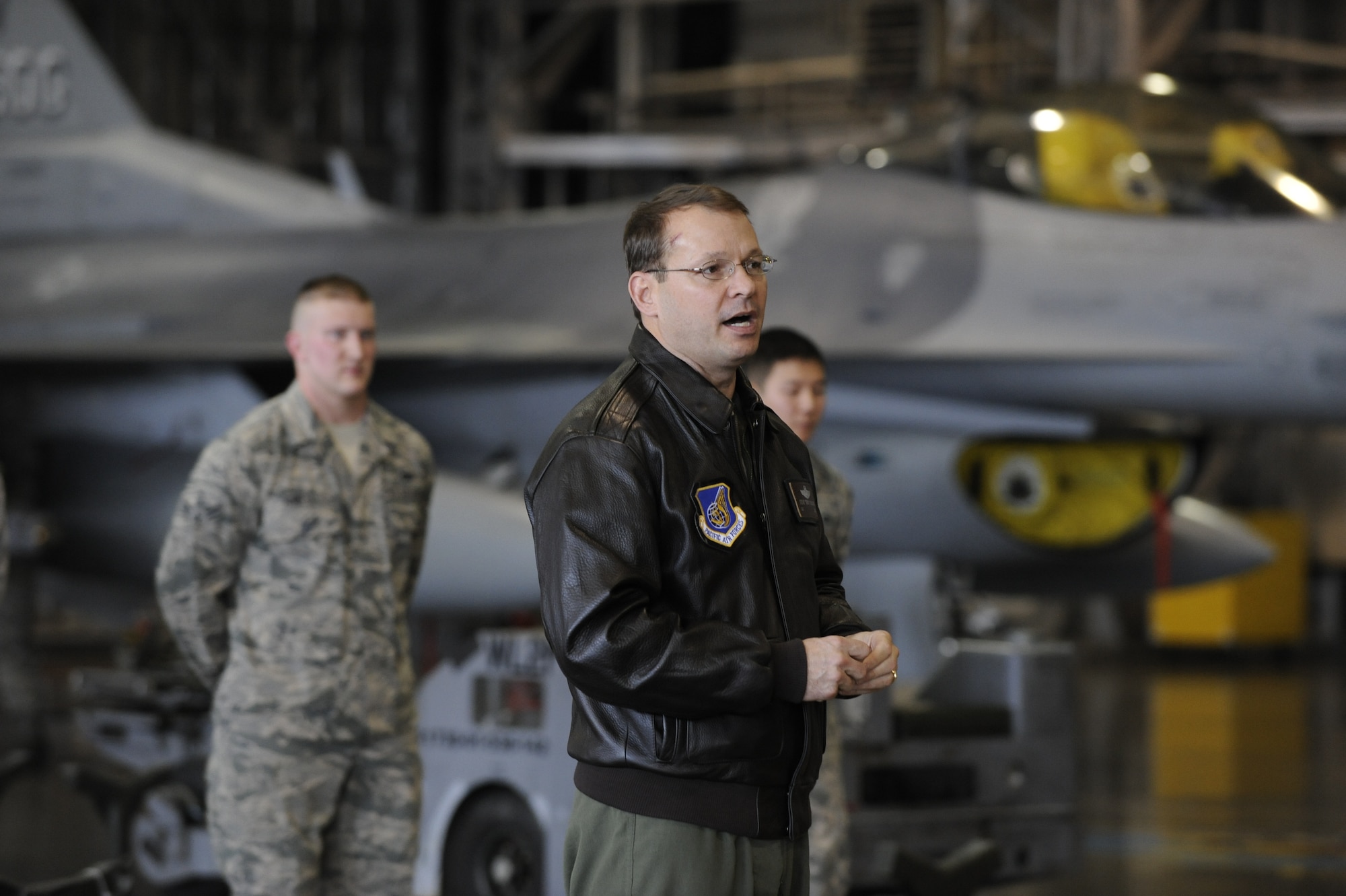 Col. Stephen Williams, 35th Fighter Wing commander, congratulates members of the 13th and 14th Aircraft Maintenance Units after the Weapons Load Crew of the Year competition at Misawa Air Base, Japan, Jan. 17, 2014. Williams was one of more than 50 Wild Weasels who observed the competition. The winning crew will be announced in March and represent the base at the Pacific Air Forces level competition. (U.S. Air Force photo/Airman 1st Class Patrick S. Ciccarone)
